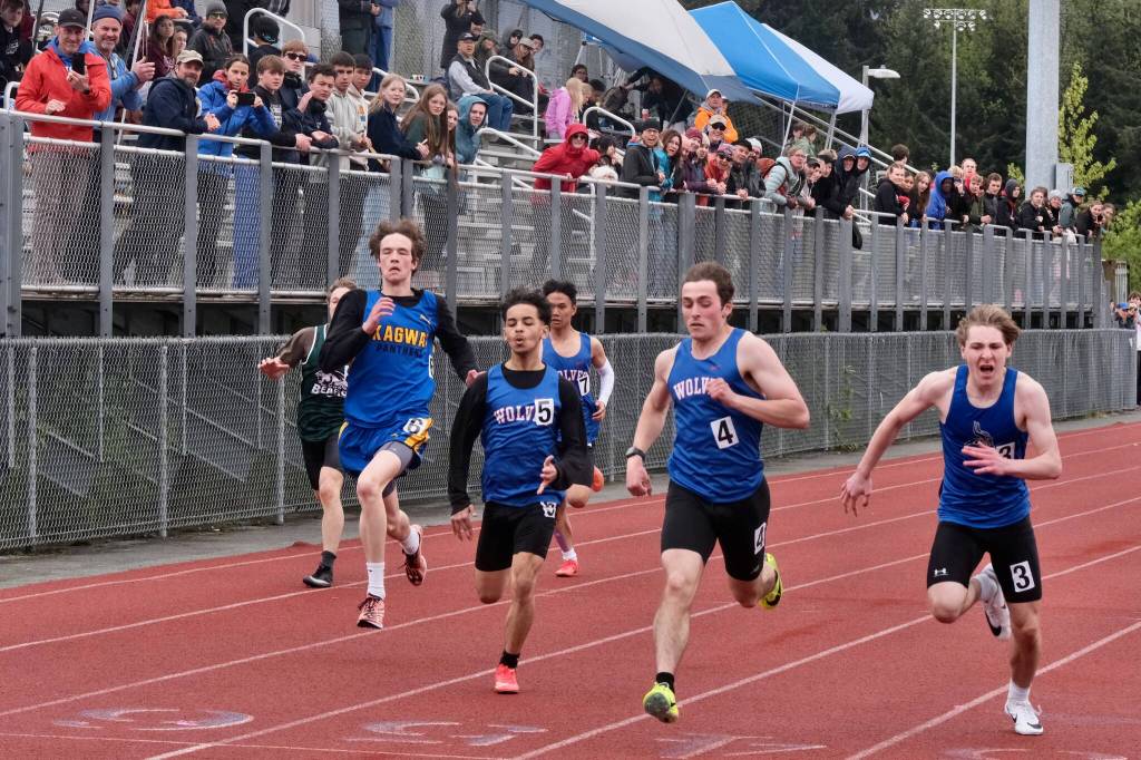 Sitka's Calder Prussian (4) wins the DII boys 200 meter race ahead of Skagway's Royce Borst (6), Siitka's Isaiah Harris (5) and Petersburg's Ben Kandoll (3) during the Region V Track & Field Championships at Juneau's Thunder Mountain Middle School on Friday. (Klas Stolpe / Juneau Empire)