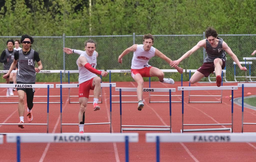 Juneau-Douglas High School: Yadaa.at Kalé's Finley Hightower and Ferguson Wheeler lead Ketchikan's Jozaiah Dela Cruz (left) and Tristen Lemerond (right) in the DI boys 300-meter hurdles during the Region V Track & Field Championships at Juneau's Thunder Mountain Middle School on Friday. (Klas Stolpe / Juneau Empire)