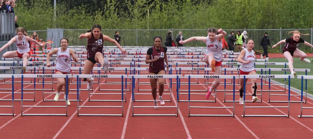Ketchikan freshman Claire Ruaro (5) and JDHS freshman Addie Hartman (3) take the final jump in the girls 100 hurdles ahead ofJuneau-Douglas High School: Yadaa.at Kalé senior Laina Mesdag (7), JD junior Isabella Reyes-Boyer (6), KTN sophomore Mariah Colbert (4), JD junior Kira Tupou and KTN sophomore Kiera Arnold during the Region V Track & Field Championships at Juneaus Thunder Mountain Middle School on Friday. (Klas Stolpe / Juneau Empire)