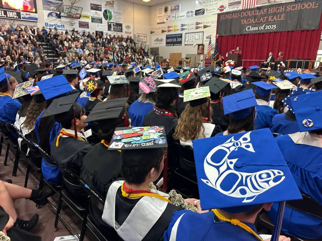 Individually decorated caps are worn by senior students during Juneau-Douglas High School: Yadaa.at Kalés graduation ceremony Sunday, May 25, 2025. (Mark Sabbatini / Juneau Empire)