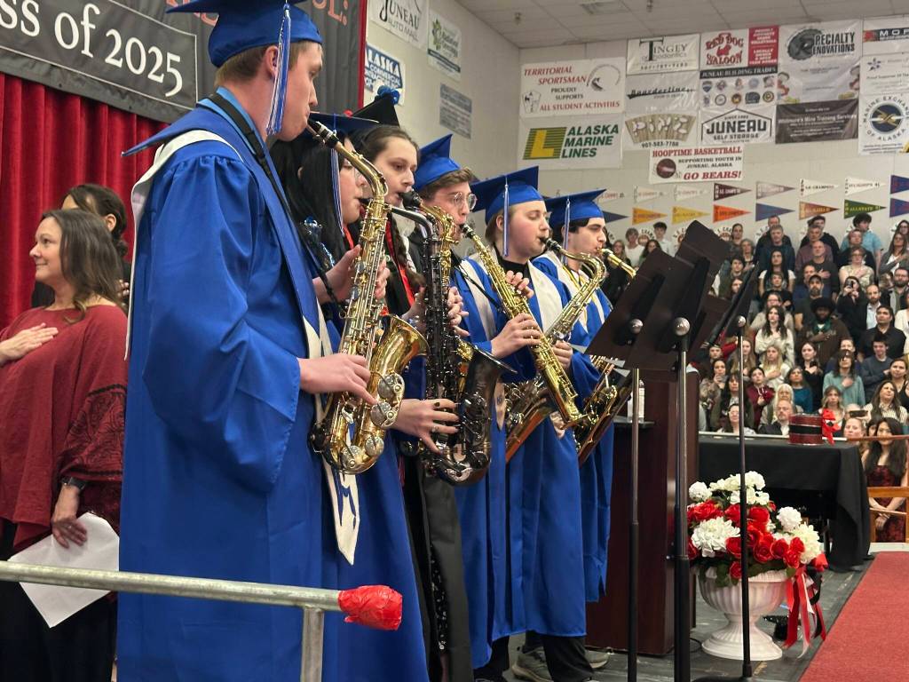 Students perform the national anthem at the beginning of Juneau-Douglas High School: Yadaa.at Kalés graduation ceremony Sunday, May 25, 2025. (Mark Sabbatini / Juneau Empire)