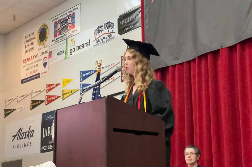 Laina Mesdag gives one of three senior student speeches during Juneau-Douglas High School: Yadaa.at Kalés graduation ceremony Sunday, May 25, 2025. (Mark Sabbatini / Juneau Empire)