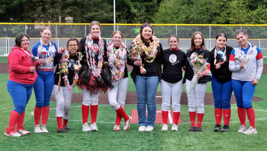 Juneau-Douglas High School: Yadaa.at Kalé and Sitka softball seniors pose for a photo Saturday at Adair-Kennedy Memorial Park during the Crimson Bears senior appreciation game. (Klas Stolpe / Juneau Empire)