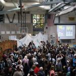 Graduates celebrate with loved ones after Yaaḵoosgé Daakahídi High Schools graduation ceremony on Sunday, May 25, 2025, at the Dzantiki Heeni campus. (Ellie Ruel / Juneau Empire)