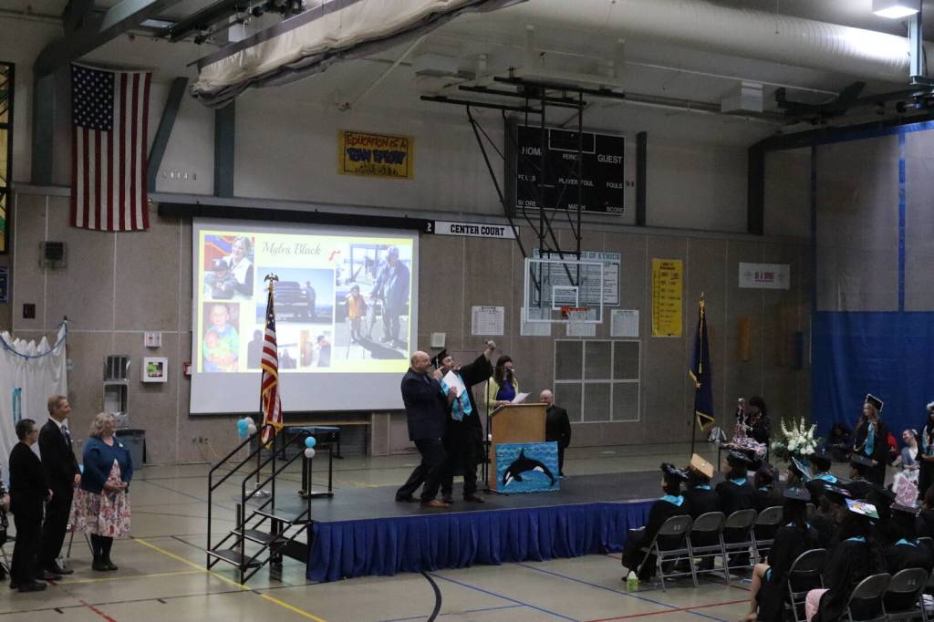 Graduate Myles Black takes a selfie with Yaaḵoosgé Daakahídi High School Principal John Paul during the schools graduation ceremony Sunday, May 25, 2025, at the Dzantiki Heeni campus. (Ellie Ruel / Juneau Empire)