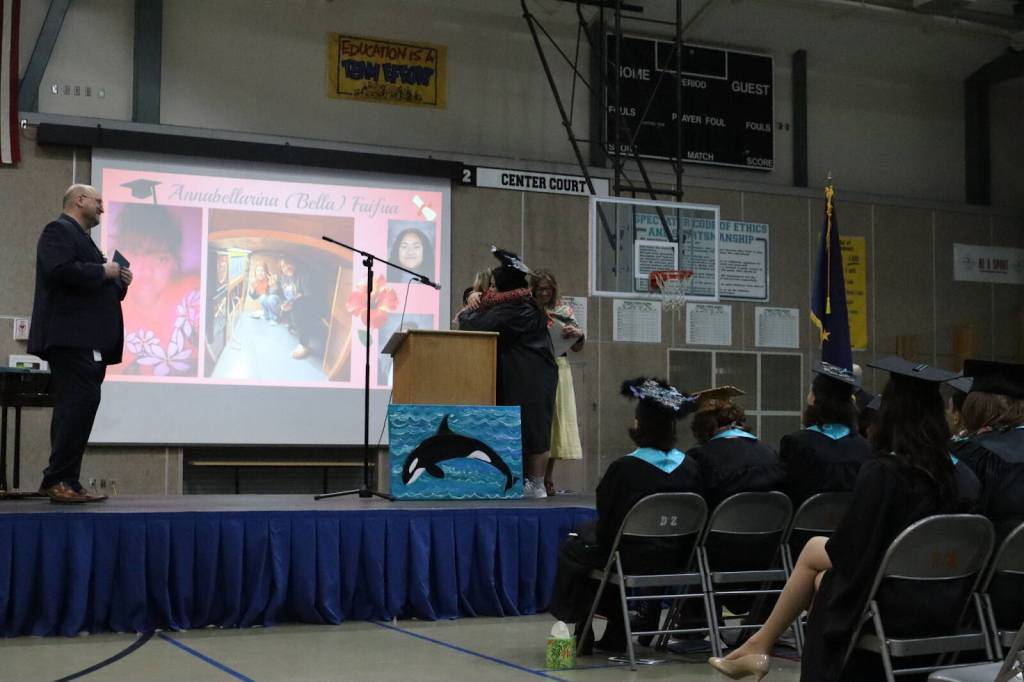 Annabellarina Faifua hugs advisor Electra Gardinier during Yaaḵoosgé Daakahídi High Schools graduation ceremony Sunday, May 25, 2025, at the Dzantiki Heeni campus. (Ellie Ruel / Juneau Empire)