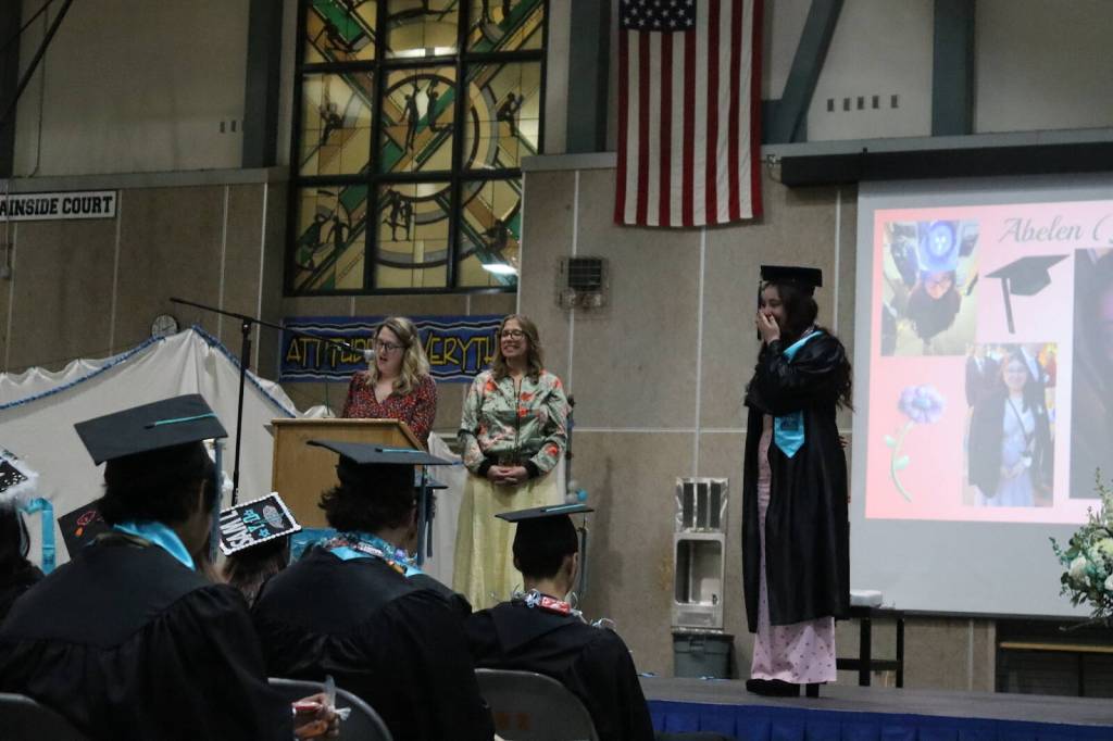 Abelen Velazco laughs at advisor Electra Gardiniers speech during Yaaḵoosgé Daakahídi High Schools graduation ceremony Sunday, May 25, 2025, at the Dzantiki Heeni campus. (Ellie Ruel / Juneau Empire)