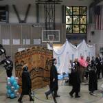 Yaaḵoosgé Daakahídi High Schools seniors enter the Dzantiki Heeni gymnasium during the schools graduation ceremony Sunday, May 25, 2025. (Ellie Ruel / Juneau Empire)