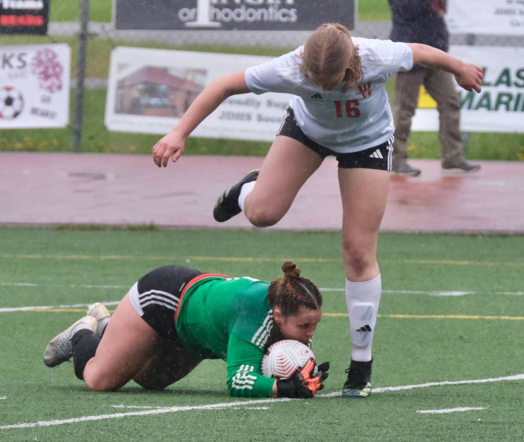 Juneau-Douglas High School: Yadaa.at Kalé junior keeper Alba Muir stops a Wasilla attack during Saturdays Crimson Bears senior appreciation game at Adair-Kennedy Memorial Park. (Klas Stolpe / Juneau Empire)