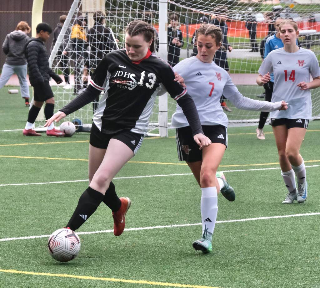 Juneau-Douglas High School: Yadaa.at Kalé senior Parker Boman (13) wins a ball against Wasilla during Saturdays Crimson Bears senior appreciation game at Adair-Kennedy Memorial Park. (Klas Stolpe / Juneau Empire)