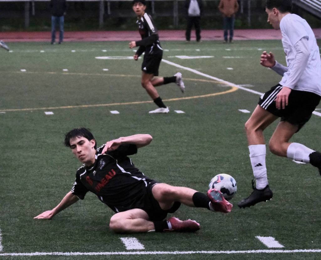 Juneau-Douglas High School: Yadaa.at Kalé senior tackles a ball away from a Wasilla player during Saturdays Crimson Bears senior appreciation game at Adair-Kennedy Memorial Park. (Klas Stolpe / Juneau Empire)