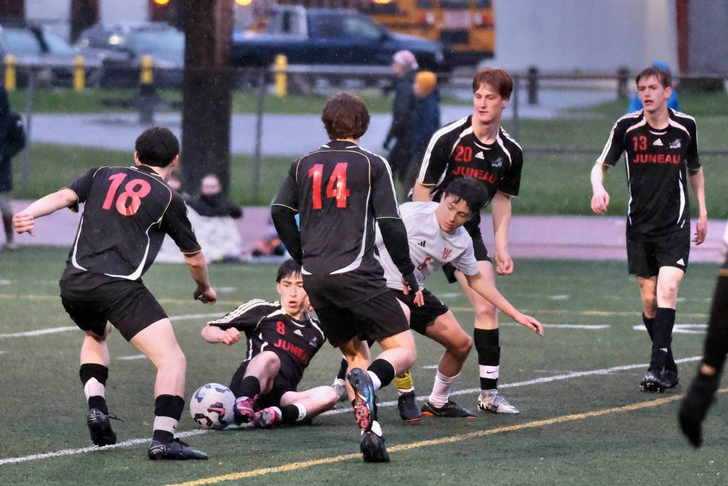 Juneau-Douglas High School: Yadaa.at Kalé senior players battle during Saturdays Crimson Bears senior appreciation game at Adair-Kennedy Memorial Park. (Klas Stolpe / Juneau Empire)