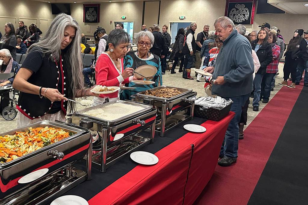 Veterans, family members and supporters line up for lunch during the Southeast Alaska Native Veterans Memorial Day gathering at Elizabeth Peratrovich Hall on Monday, May 26, 2025. (Mark Sabbatini / Juneau Empire)