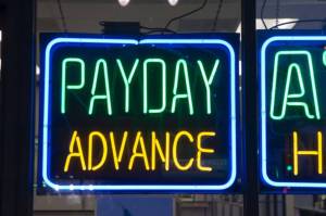 A payday advance neon sign is seen in this undated photo. (EHStock/Getty Images)