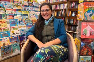 Olga Lijo Serans, owner of Hearthside Books, discusses its inclusion in USA Todays voting competition to determine the 10 Best Independent Bookstores in the U.S. at her Nugget Mall branch on Monday, May 26, 2025. (Mark Sabbatini / Juneau Empire)