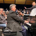 Pianist Jeffrey Biegel rehearses Rhapsody in Red, White, and Blue under the direction of Tigran Arakelyan, the fourth and final guest music director seeking the position for the Juneau Symphony, on Thursday, May 29, 2025, in the Juneau-Douglas High School: Yadaa.at Kalé auditorium. This is Biegels 50th performance of the piece that he is planning to perform in all 50 states. (Mark Sabbatini / Juneau Empire)