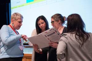 Sitka Municipal Clerk Sara Peterson, left, looks over paperwork from precinct 1 with Holley Bayne, Precinct 1 chair Alix Snelling and deputy Clerk Jess Earnshaw. durinng Wednesday nights tally of votes at Harrigan Centennial Hall. Unofficial results have 773 in favor and 2,071 against the proposition which would have limited cruise visitors ashore to 300,000 annually, and 4,500 daily; required at least one quiet day a week with no large ships; and implemented a permit system for cruise ships. (James Poulson / Daily Sitka Sentinel)