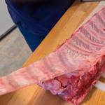 Removing the silver skin from a rack of baby back ribs. (Photo by Patty Schied)