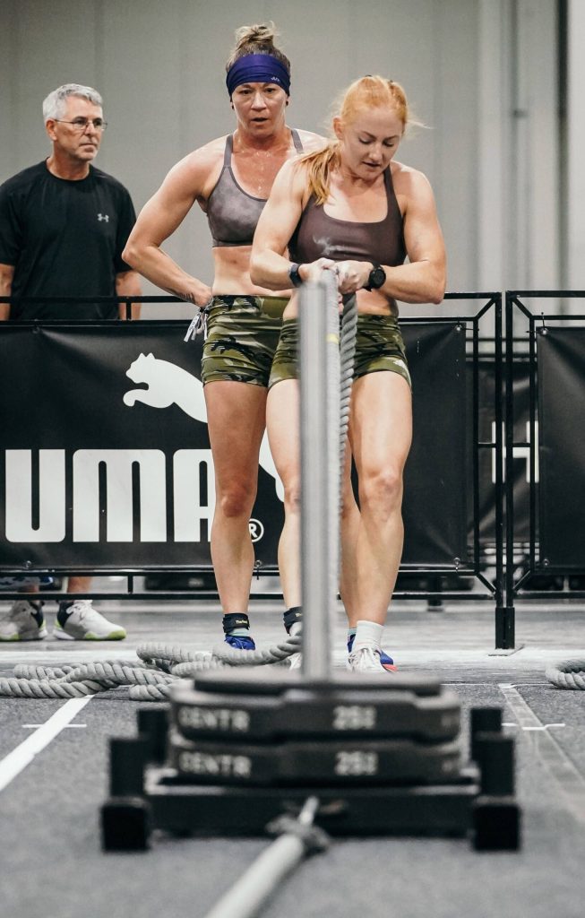 Chrish Newell, right, and partner Jess Contreras, left, compete in the sled pull station during the HYROX 2025 Atlanta Doubles in late April. They qualified for the World Championships scheduled Sunday, June 15, 2025, in Chicago. (Photo courtesy Chrish Newell)