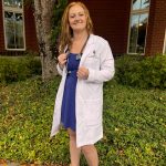 Chrish Newell at her White coat ceremony in 2023 just before starting vet school. She was seven weeks post ACL/meniscus reconstruction surgery at the time. (Photo courtesy Chrish Newell)