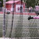Juneau-Douglas High School: Yadaa.at Kalé senior Ahmir Parker (9) hits a penalty shootout past Service sophomore keeper Nathaniel Thate (00) during the Crimson Bears 1-1 (5-4) win over Service to open the 2025 ASAA/First National Bank Alaska Soccer State Championships at Wasilla High School on Thursday, May 29, 2025. (Klas Stolpe / Juneau Empire)