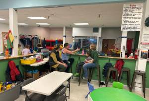 Karen Levasseur (left), Cyndy Norbryhn (middle), and Jessica Estes and her daughter May, 7, chat at Rainforest Play Zone in the Mendenhall Mall on Friday, May 30, 2025. The play zone is moving to a different location in the mall, with Hearthside Books and Toys scheduled to move in Rainforests current space by September. (Mark Sabbatini / Juneau Empire)