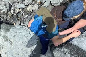 Kell Morris, left wearing a brown hat, was trapped under a 700-pound boulder near Seward on Saturday, May 24, 2025. (Jason Harrington/Seward Fire Department)