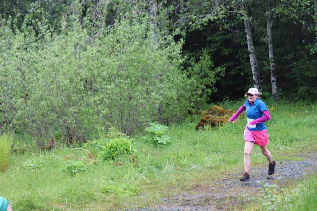 Susan Crandall, 58, approaches the finish line at the 2025 Spring Tide Scramble on Saturday, May 31, 2025. (Ellie Ruel / Juneau Empire)