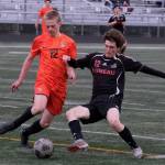 Juneau-Douglas High School: Yadaa.at Kalé senior Ryan Thibodeau works for a ball against West Anchorage during the Crimson Bears’ 3-2 loss in extra time to the Eagles in the 2025 ASAA/First National Bank Alaska Soccer State Championship semifinals Friday at Wasilla High School. (Klas Stolpe / Juneau Empire)