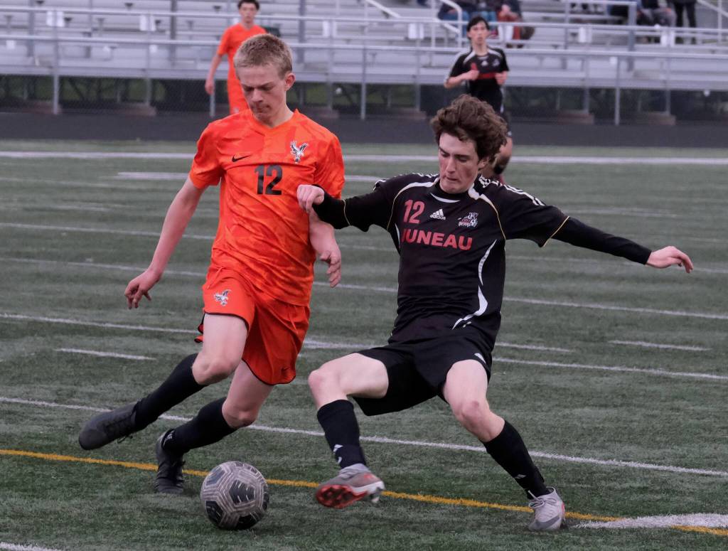 Juneau-Douglas High School: Yadaa.at Kalé senior Ryan Thibodeau works for a ball against West Anchorage during the Crimson Bears’ 3-2 loss in extra time to the Eagles in the 2025 ASAA/First National Bank Alaska Soccer State Championship semifinals Friday at Wasilla High School. (Klas Stolpe / Juneau Empire)