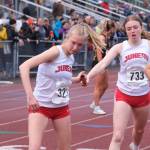 Juneau-Douglas High School: Yadaa.at Kalés Sigrid Eller takes the baton from Siena Farr during the girls 4x800 relay during the 2025 ASAA/First Bank Alaska State Track & Field Championships on Saturday at Anchorages Dimond High School. (Klas Stolpe / Juneau Empire)