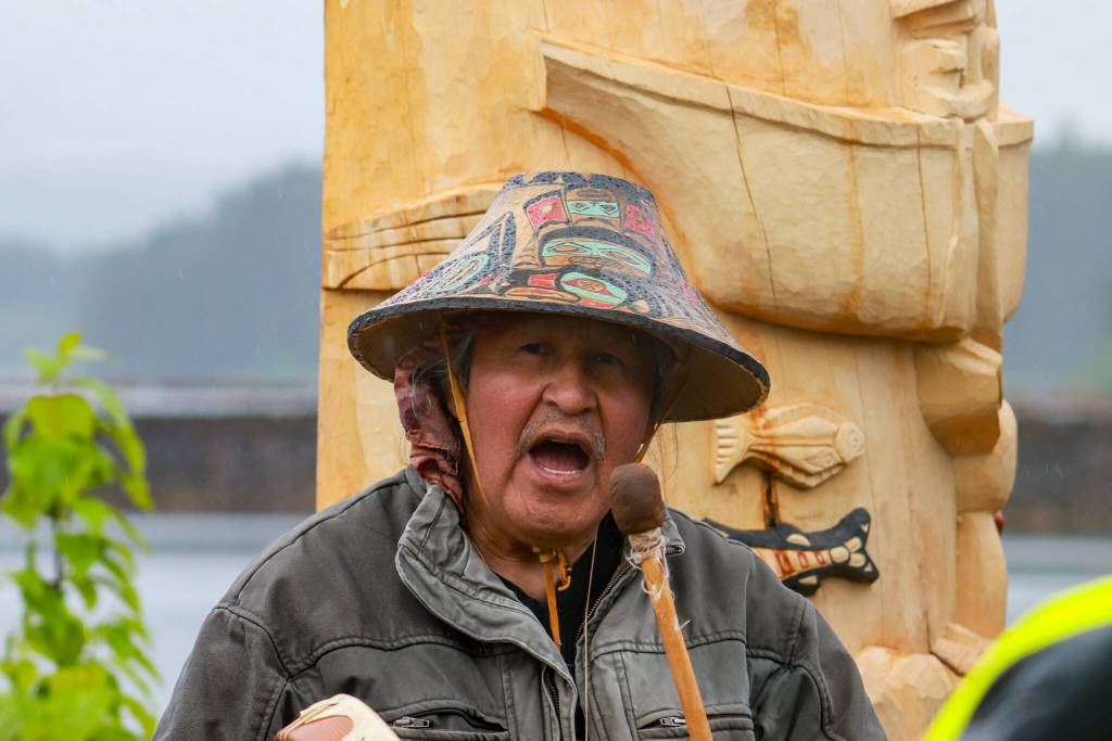 Carver Herb Sheakley sings at the Fishermans Honor Totem Pole Ceremony in Hoonah on Friday, May 30, 2025. (Jasz Garrett / Juneau Empire)