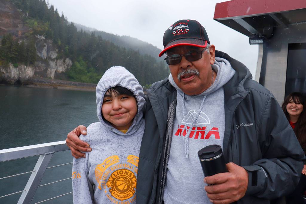 Frank Lee with his granddaughter aboard the catamaran approaching Hoonah on Friday, May 30, 2025. (Jasz Garrett / Juneau Empire)