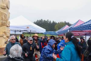 People dance in celebration of the Fishermans Honor Totem Pole in Hoonah on Friday, May 30, 2025. (Jasz Garrett / Juneau Empire)