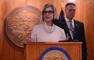 Deena Bishop, commissioner of the Alaska Department of Education and Early Development, speaks at a news conference Friday, March 15, 2024, with Gov. Mike Dunleavy. (James Brooks/Alaska Beacon)