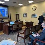 Juneau School District Superintendent Frank Hauser watches Deena Bishop, commissioner of the Alaska Department of Education and Early Development, discuss the federal disparity test for education funding provided by states during a Senate Education Committee meeting Wednesday, May 14, 2025. (Mark Sabbatini / Juneau Empire file photo)