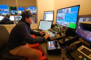 Tulio Fontanella, a first-year production technician with Gavel, controls the cameras at a Senate Finance Committee meeting on Feb. 13, 2025. (Corinne Smith/Alaska Beacon)