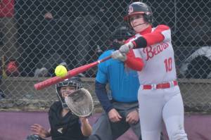 In this file photo Juneau-Douglas High School: Yadaa.at Kalé sophomore Brynn Wheeler connects on a pitch against Lathrop. Wheeler and the Crimson Bears lost to South and defeated Dimond on Thursday in the 2025 ASAA/First National Bank Alaska DI Softball State Championships on Anchorages Cartee Fields. (Klas Stolpe / Juneau Empire)