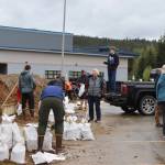 People load sandbags into their vehicles at the sandbag pickup/open house event on Saturday, June 7, 2025, at Thunder Mountain Middle School. (Ellie Ruel / Juneau Empire)