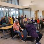 Attendees chat before the Juneau Flood Preparedness Workshop at the Mendenhall Valley Public Library on Saturday, June 7, 2025. (Ellie Ruel / Juneau Empire)