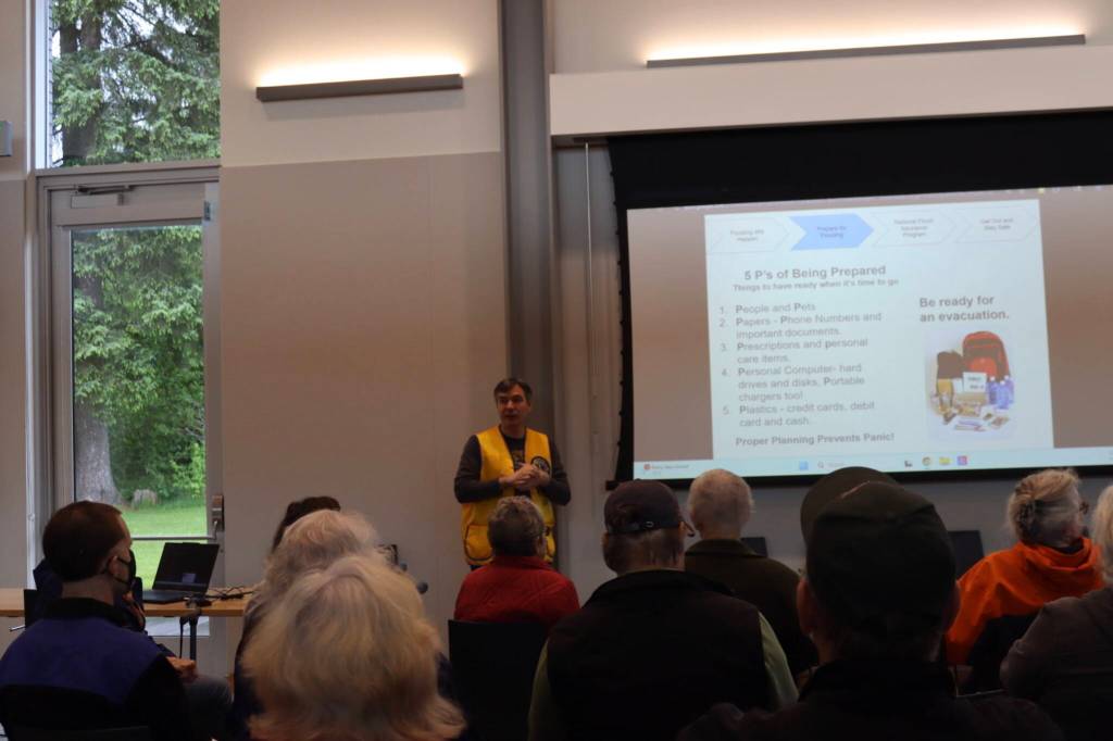 Lions Club volunteer Sam Hatch speaks to the crowd at the Juneau Flood Preparedness Workshop at the Mendenhall Valley Public Library on Saturday, June 7, 2025. (Ellie Ruel / Juneau Empire)