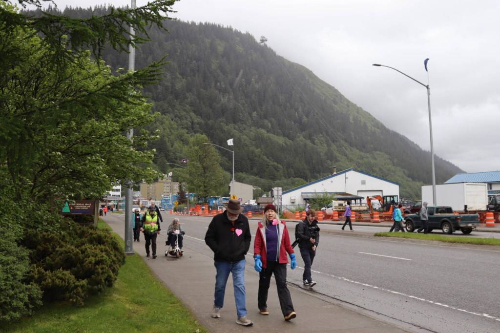 Participants chat during the Cancer Survivors Day walk on Sunday, June 8, 2025. (Ellie Ruel / Juneau Empire)