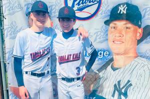 Juneau-Douglas High School: Yadaa.at Kalé junior pitcher Hunter Carte (7) and freshman pitcher Micah Nelson (3) pose for a photo at the 2025 ASAA/First National Bank Alaska DI Baseball State Tournament at Anchorages Mulchay Stadium. (Photo courtesy JDHS baseball)