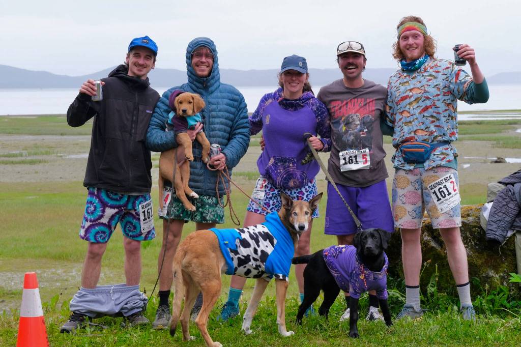 Winning team Stinky Rats Brady McDonell, Sam Fernandez, Kristen Strom, Jason Norat and Sean Griffin pose at the finish line of the Seacoast Relay at the Eagle Beach State Park outer beach picnic shelter on Sunday, June 8, 2025. (Klas Stolpe / Juneau Empire)