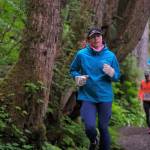 Runners on the Auke Lake Trail in the first leg of the Seacoast Relay on Sunday, June 8, 2025. (Klas Stolpe / Juneau Empire)