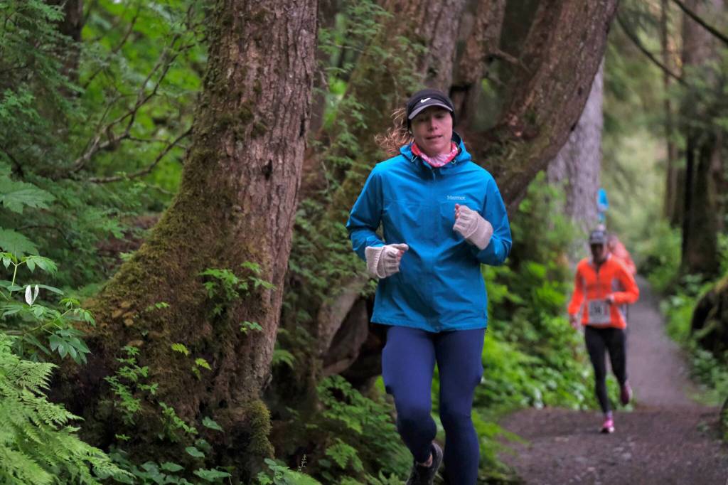 Runners on the Auke Lake Trail in the first leg of the Seacoast Relay on Sunday, June 8, 2025. (Klas Stolpe / Juneau Empire)