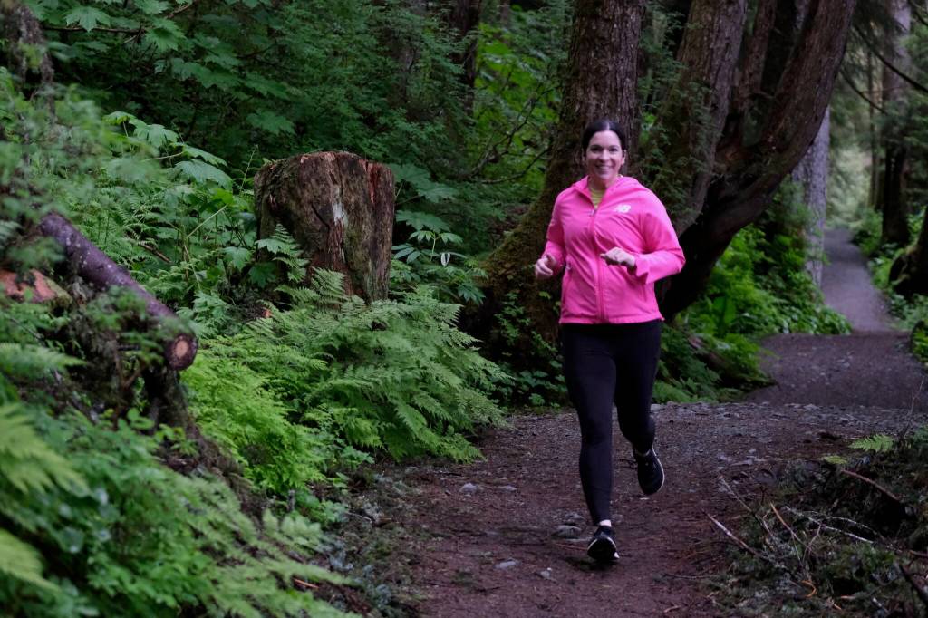 A racer on the Auke Lake Trail in the first leg of the Seacoast Relay on Sunday, June 8, 2025. (Klas Stolpe / Juneau Empire)