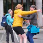 Runners embrace during the Seacoast Relay at the University of Alaska Southeast campus Sunday, June 8, 2025. (Klas Stolpe / Juneau Empire)