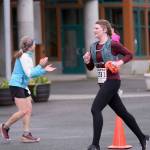 Christina Schulte-Pereyra of team Cirque de Sore Legs goes through the first leg of the Seacoast Relay at the University of Alaska Southeast campus on Sunday, June 8, 2025. (Klas Stolpe / Juneau Empire)