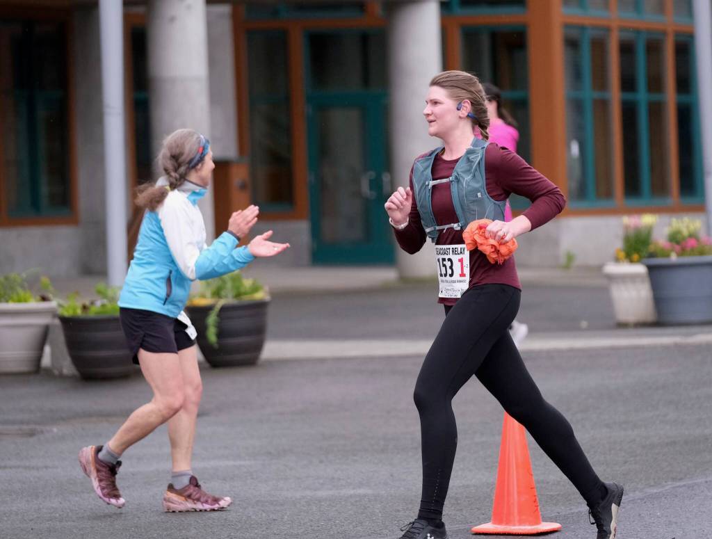 Christina Schulte-Pereyra of team Cirque de Sore Legs goes through the first leg of the Seacoast Relay at the University of Alaska Southeast campus on Sunday, June 8, 2025. (Klas Stolpe / Juneau Empire)
